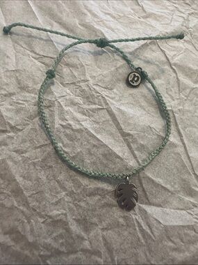NWOT Pura Vida Light Green Braided Cord Bracelet with Silver Monstera Charm